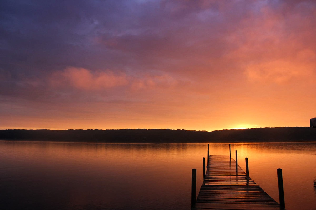 Peaceful dock at sunrise marking the start of boating season