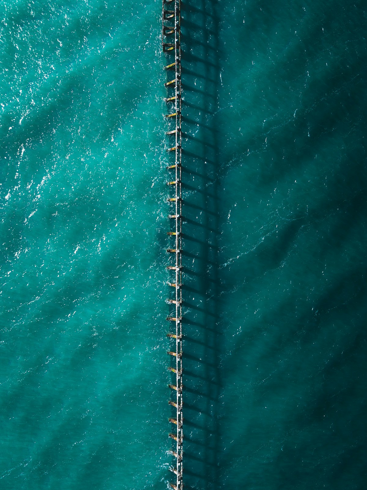 Aerial view of quiet beachfront for spring layering season